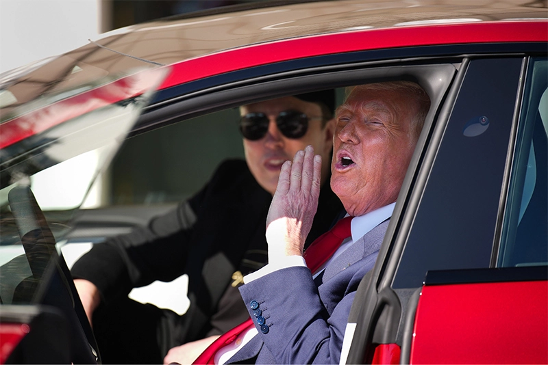 Watch: Trump behind the wheel in Red Tesla Sedan
