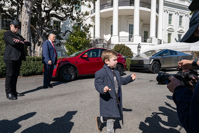 Watch: Trump behind the wheel in Red Tesla Sedan